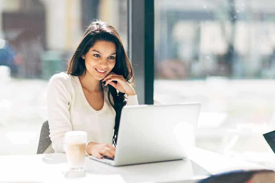 Person using accounting software in cafe